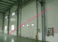De volledige Verticale Liftdeur motoriseerde Industriële Garagedeuren met Transparante Vensters en Voettoegang leverancier